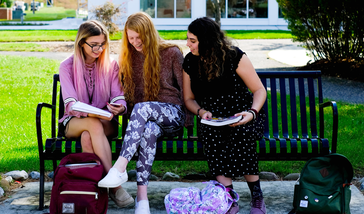 jackrabbitreds.com three female students studying on a bench on camp at Ocean County College